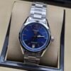 TAG Heuer — esfera azul y brazalete de acero