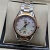 TAG Heuer — esfera blanca nacarada, bisel oro rosa con brillantes y brazalete de acero