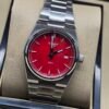 Tissot — esfera roja y brazalete de acero