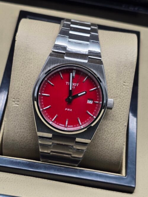 Tissot — esfera roja y brazalete de acero
