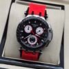 Tissot — cronógrafo con esfera negra y subesferas blancas, correa roja