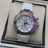 Tissot — cronógrafo con esfera blanca, bisel de piedras multicolor y correa blanca