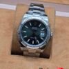 Rolex — esfera verde con bisel estriado y brazalete de acero