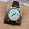 Patek Philippe — esfera crema, caja dorada y correa de cuero marrón