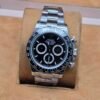 Rolex — cronógrafo con esfera negra y brazalete de acero