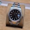 Rolex — esfera chocolate con bisel estriado rosado y brazalete bicolor