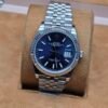 Rolex — esfera azul con bisel estriado y brazalete jubilee de acero