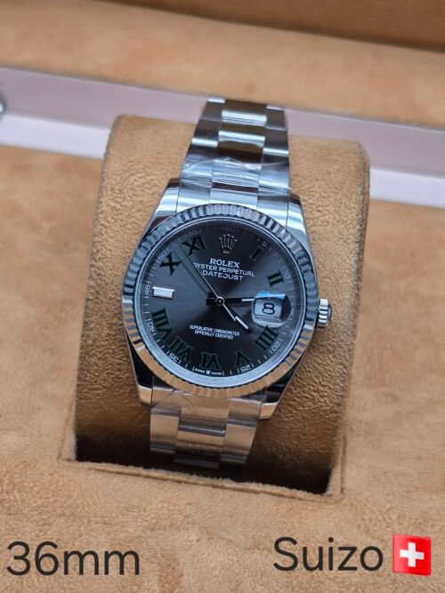 Rolex — esfera gris con números romanos verdes y brazalete de acero