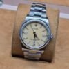 Rolex — esfera amarilla y brazalete de acero