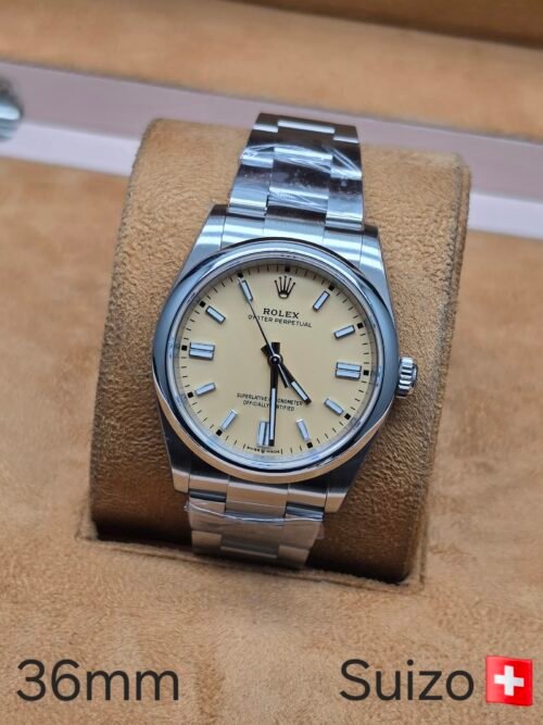 Rolex — esfera amarilla y brazalete de acero