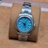 Rolex — esfera turquesa y brazalete de acero