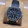 Patek Philippe — esfera negra y correa de caucho negra